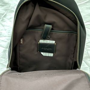 COACH crossbody single strap backpack